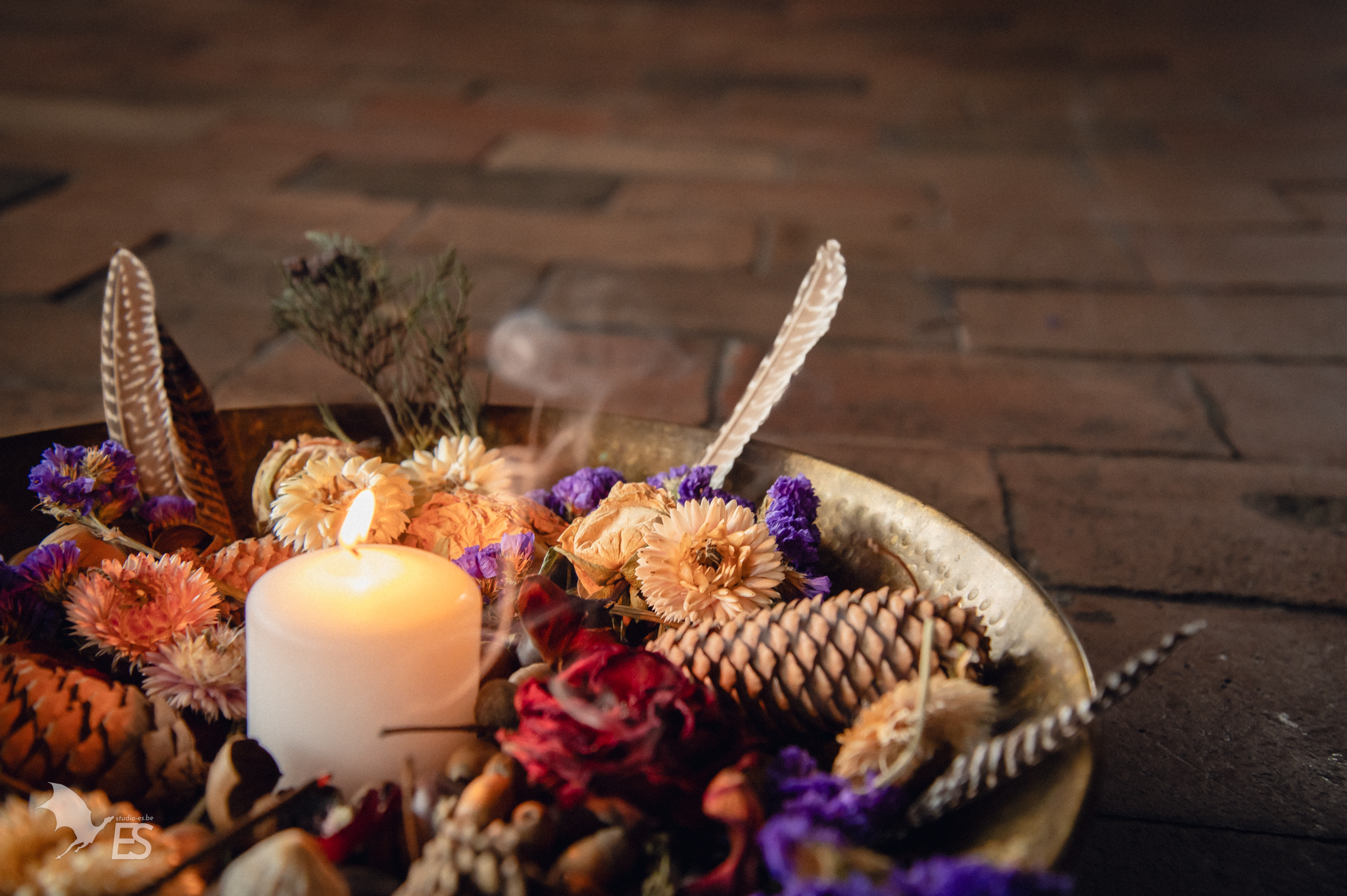 A beautiful installation with a candle and flowers