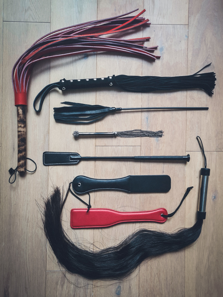 assortiment of whips, floggers and paddles